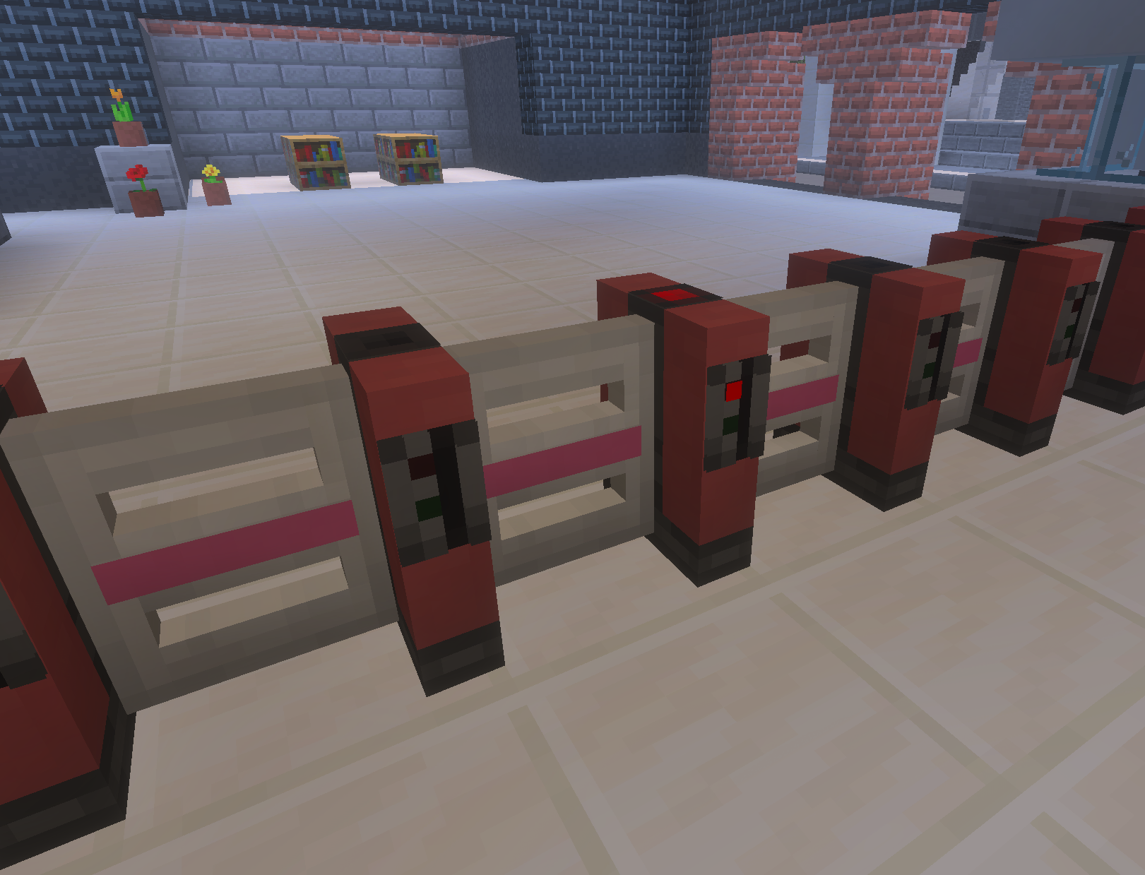 A line of turnstiles, with one flashing red after a failed ticket scan.
